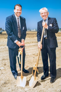 Thomas Wermers (current CEO of Wermers Companies) breaks ground alongside his father and company founder, James J. Wermers. Photo taken in 1997 at the groundbreaking of Sycamore Apartments in Northern California.